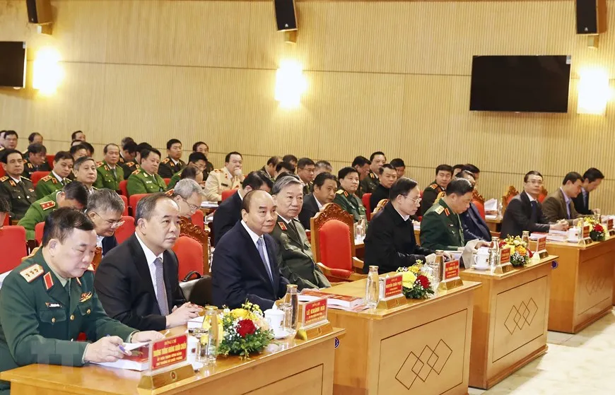 Chủ tịch nước Nguyễn Xuân Phúc cũng các lãnh đạo ngành công an dự hội nghị. Ảnh: TTXVN