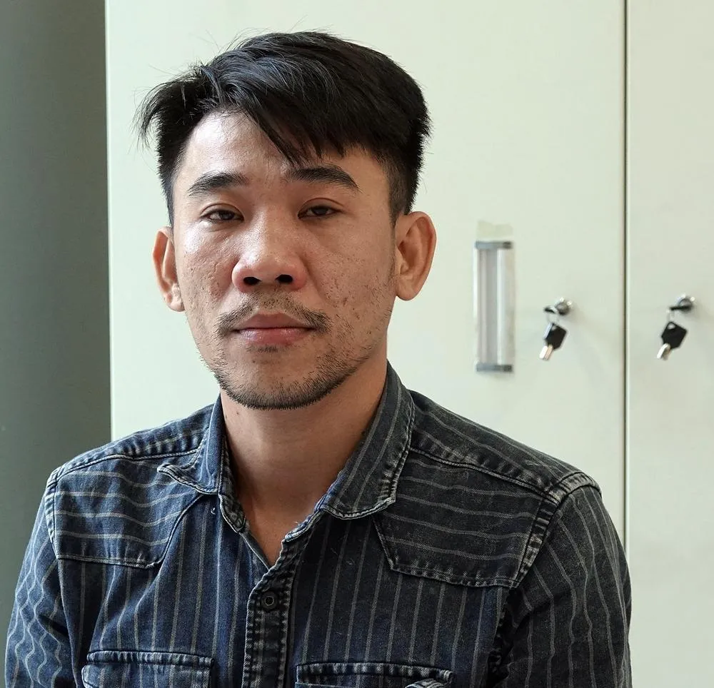 Lê Quang Hùng tại Cơ quan điều tra. Ảnh NY.