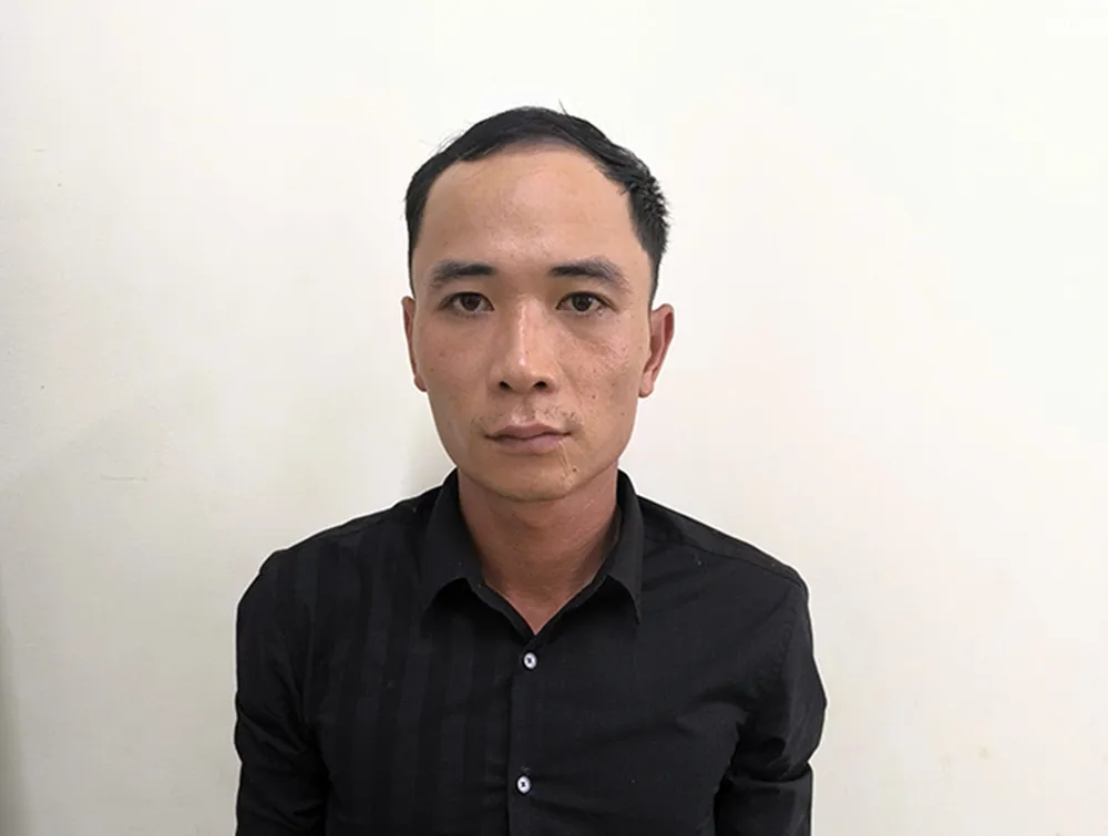 Trần Bình Dương tại cơ quan công an. Ảnh CATP. ra đầu thú