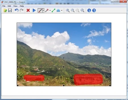 Tảng đá và thông tin ngày giờ chụp ở file ảnh gốc (trên) đã bị loại bỏ nhờ InPaint