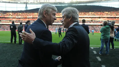 HLV Wenger và Pellegrini sau khi kết thúc trận đấu. Ảnh: PA. arsenal-premier-league-manches-3389-6418