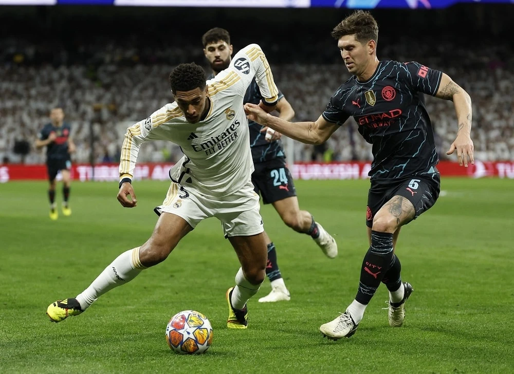 Hai đội bất phân thắng bại ở trận lượt đi tứ kết Champions League. Ảnh: Reuters IMG_8608.jpeg