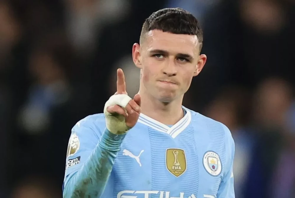 Phil Foden là ngôi sao không thể thiếu trong đội hình Man City lúc này. ẢNH: GETTY man-city-phil-foden.jpg