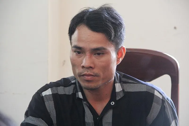 Đoàn Minh Hải sau khi bị bắt giữ. Ảnh: TẤN LỘC