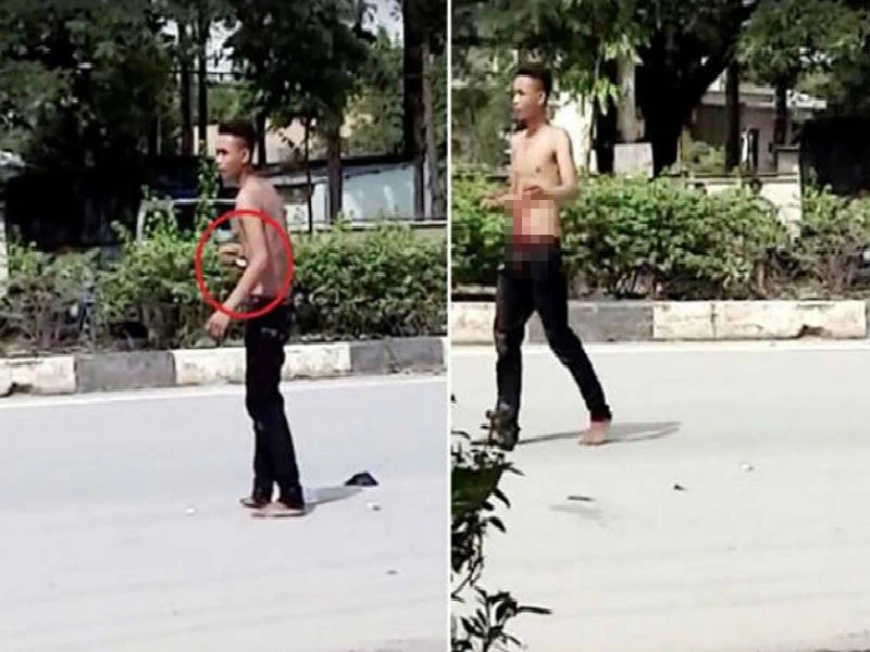 Nam thanh niên tự đâm vào bụng rồi la hét giữa đường ảnh 1