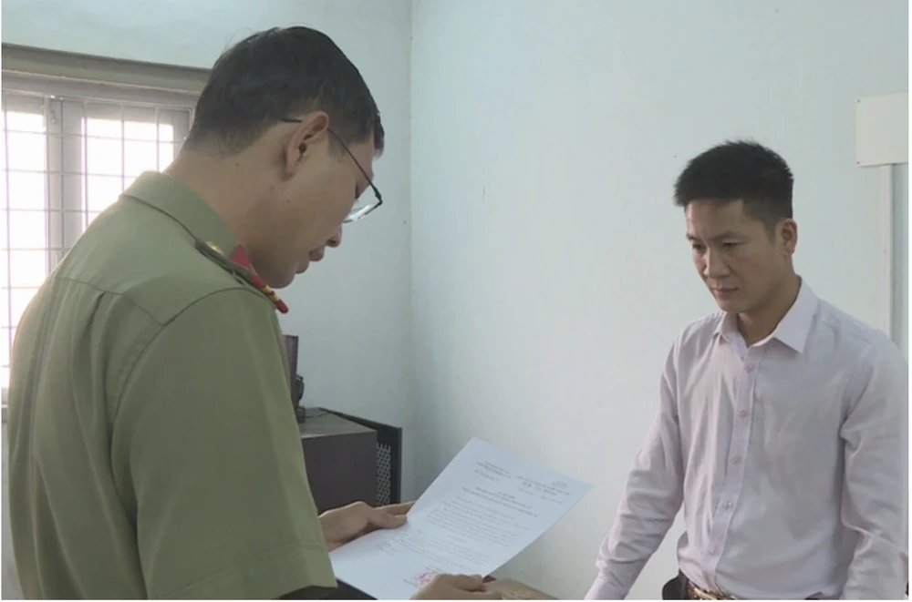 Trần Tiến Dũng tại cơ quan công an. Ảnh: AX