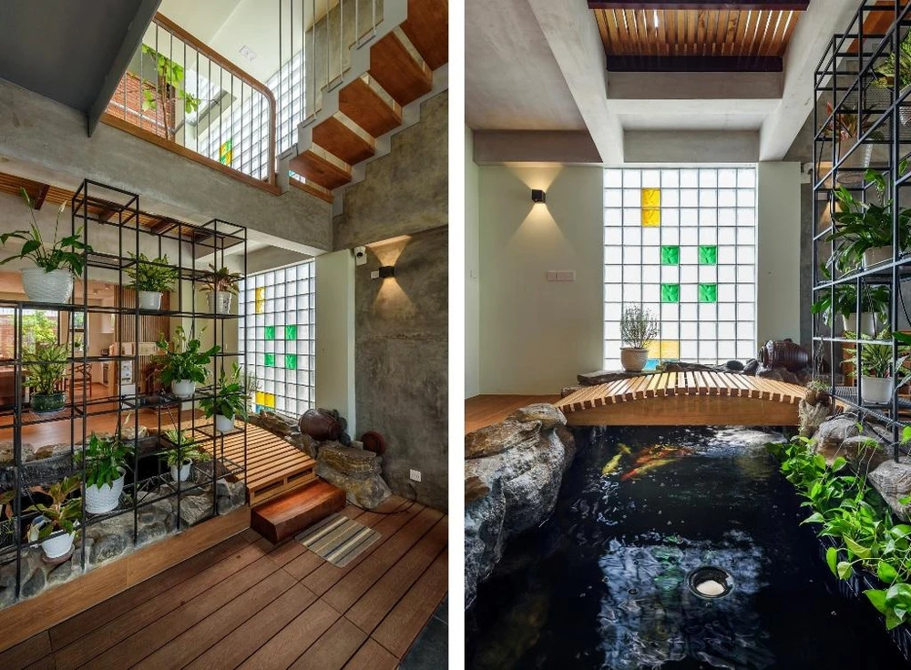 Cầu thang sắt bản bậc gỗ thay thế cho thang bê tông truyền thống.