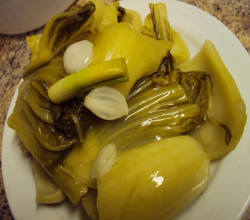 Dưa muối chua thúc đẩy tiêu hóa, tăng cường hệ miễn dịch cho cơ thể.