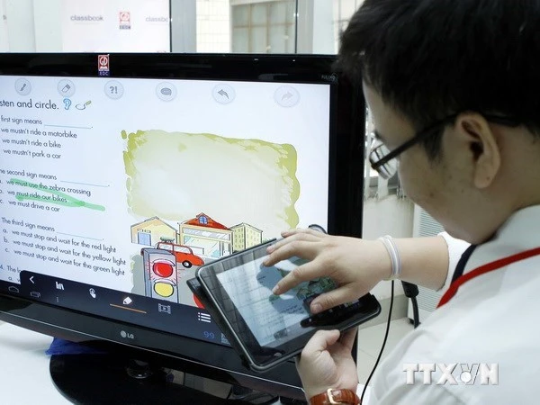 TTXVN: Cân nhắc việc sử dụng máy tính bảng cho học sinh tiểu học ảnh 1