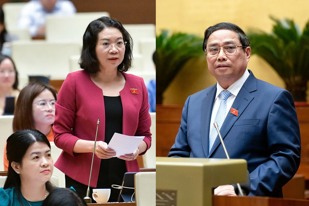 Thủ tướng Phạm Minh Chính (phải) và đại biểu Mai Thị Phương Hoa (đoàn Nam Định) tại phiên chất vấn và trả lời chất vấn chiều 12-11. Ảnh: PHẠM THẮNG