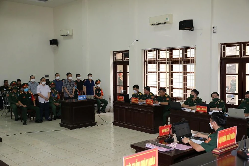 Các bị cáo tại tòa ngày 12-7. Ảnh: Thông tấn Quân sự