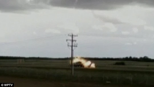 Fireball: Al and Bettys pick up truck bursts into flames as lighting strikes it on an Alberta road