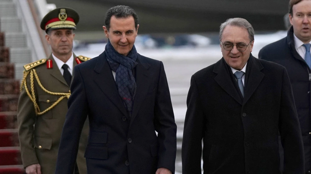 Tổng thống Syria Bashar al-Assad (trái) được ông ông Mikhail Bogdanov - đại diện đặc biệt của Tổng thống Nga Vladimir Putin tiếp đón ở sân bay Vnukovo ở thủ đô Moscow (Nga). Ảnh: SANA