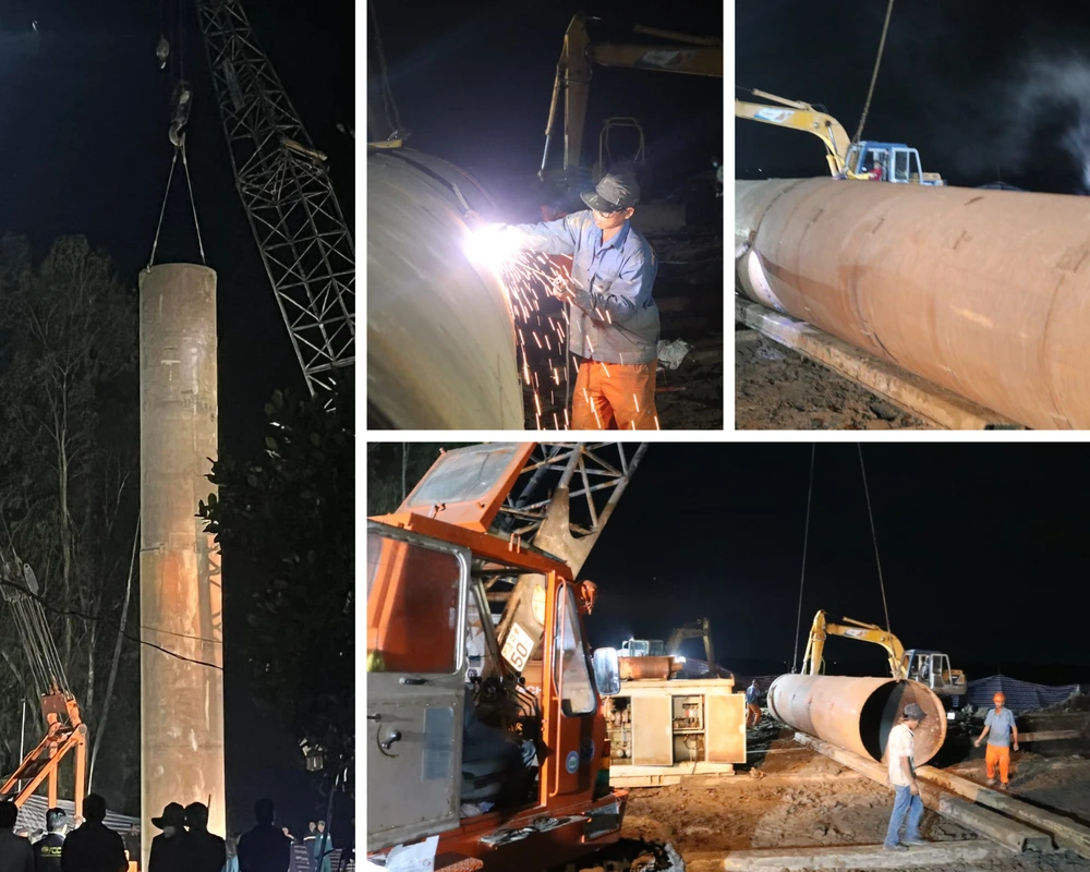 Ống thép được đưa vào hiện trường và cẩu lên để bọc lấy cọc bê tông rồi nhổ cọc này lên. Ảnh: BÌNH MINH- NAM GIAO