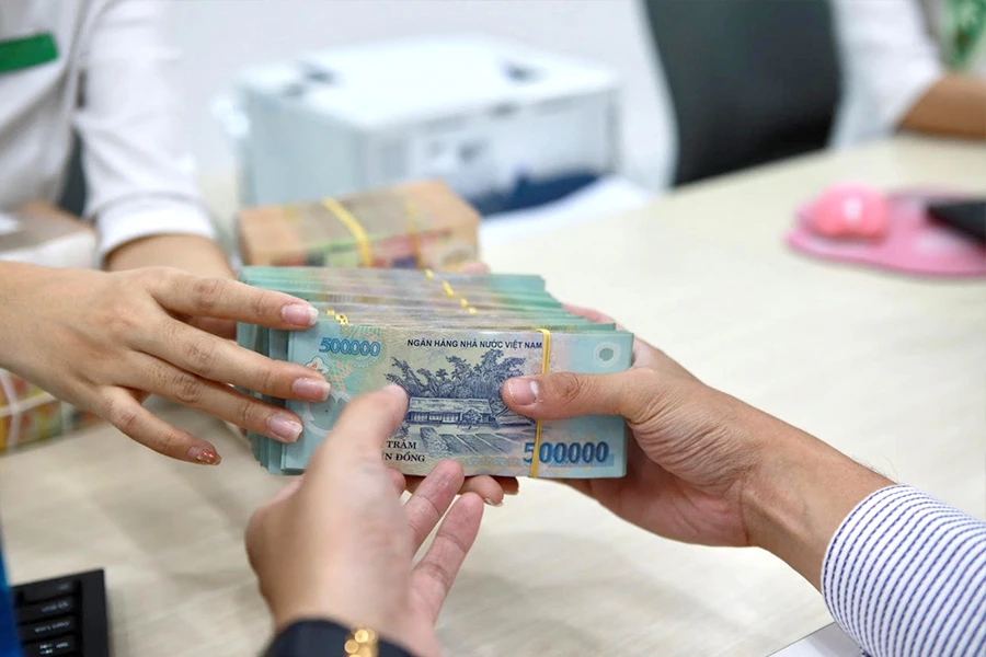 Từ ngày 3-4, Ngân hàng Nhà nước giảm 0,3%-0,5%/năm các mức lãi suất điều hành để tạo cơ hội giảm lãi suất cho vay. Ảnh: NGUYỆT NHI