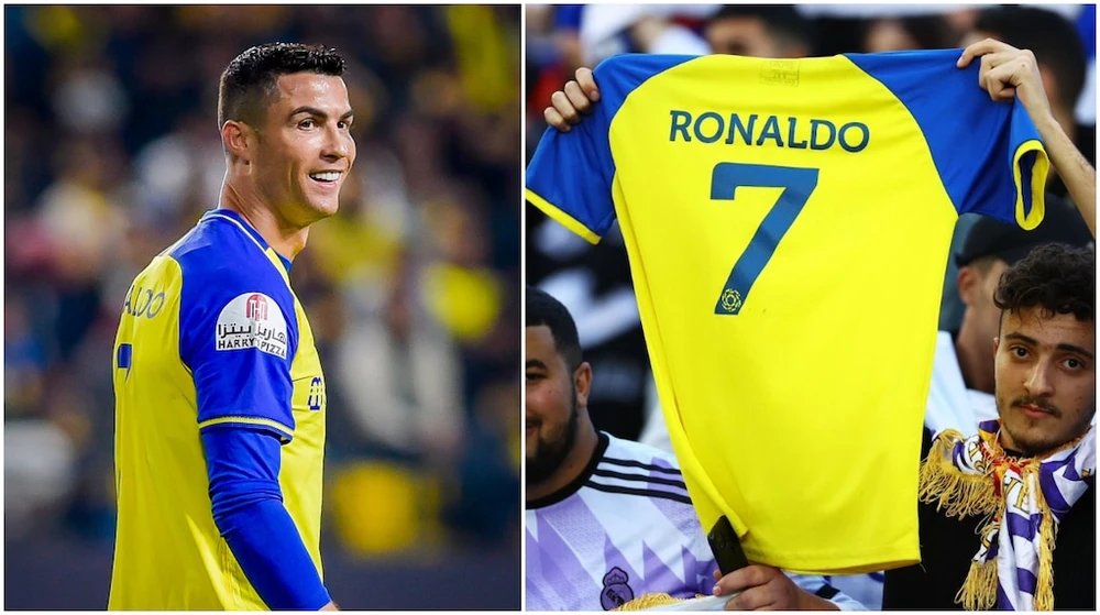Một cổ động viên Real Madrid giơ cao chiếc áo đấu Al Nassr của Ronaldo trong trận chung kết cúp các CLB. Ảnh: GETTY.