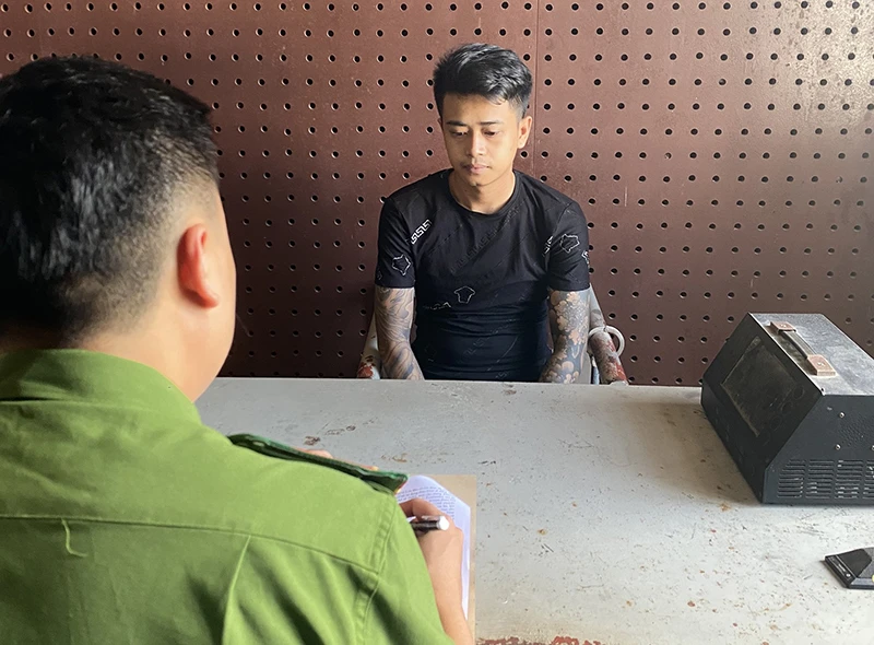 Lê Văn Đức tại cơ quan công an. Ảnh: T.T