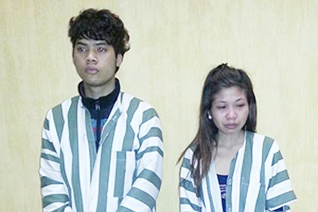 Nguyễn Vũ Túc và Bùi Thị Cúc tại cơ quan điều tra.