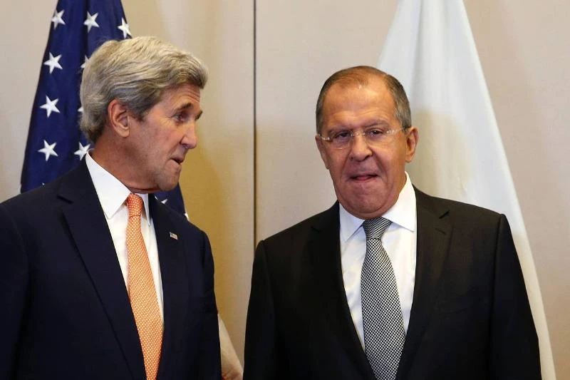 Ngoại trưởng Mỹ John Kerry (trái) và Ngoại trưởng Nga Sergei Lavrov gặp nhau đàm phán về Syria tại Geneva (Thụy Sĩ) ngày 9-9. 