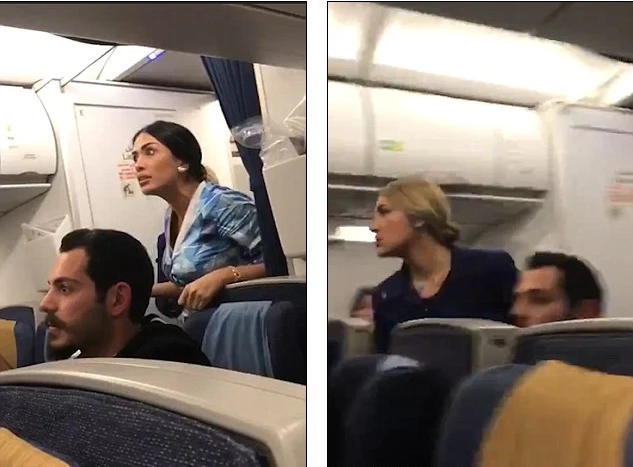 Hành khách và nhân viên trên máy bay can ngăn. Ảnh: DAILY MAIL