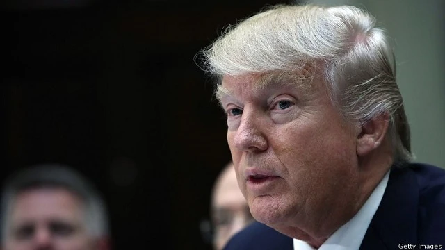 Ông Trump sẽ ký thông qua dự luật trừng phạt Nga. Ảnh: EPA