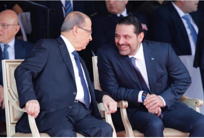 Thủ tướng Lebanon Saad al-Hariri (phải) và Tổng thống Lebanon Michel Aoun tham dự lễ diễu binh kỷ niệm ngày độc lập lần thứ 74 của Lebanon tại trung tâm thủ đô Beirut ngày 22-11. Ảnh: REUTERS