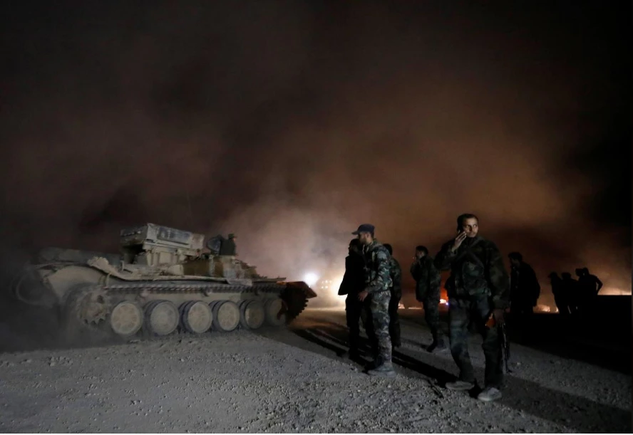 Binh sĩ Syria tại thị trấn Harasta, Đông Ghouta ngày 22-3. Ảnh: REUTERS