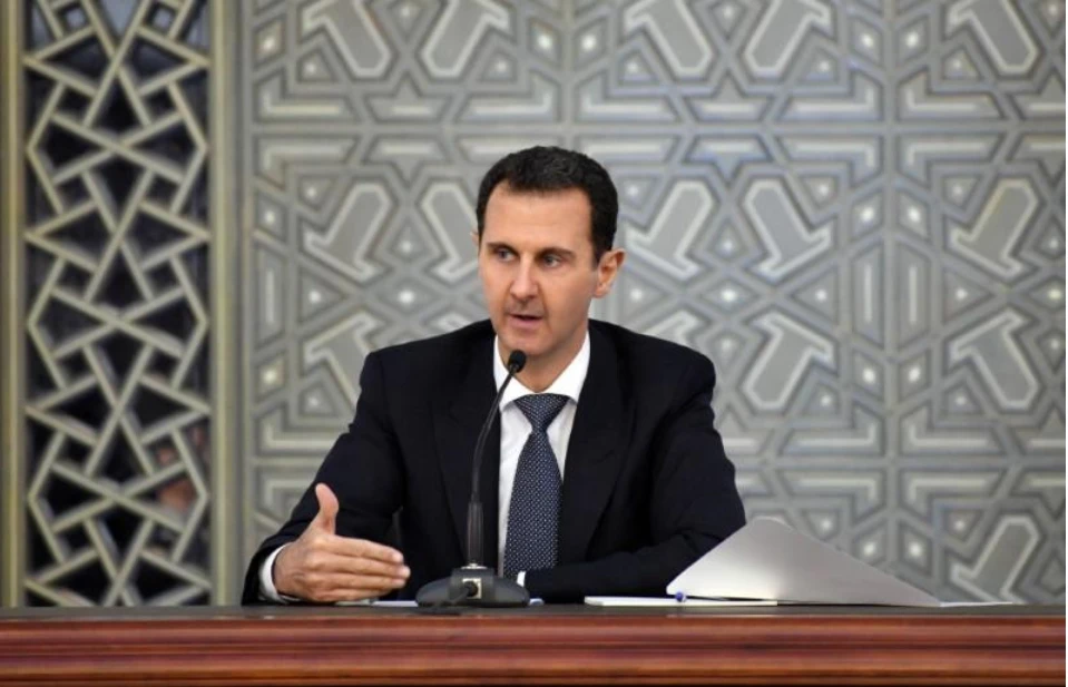 Tổng thống Syria Bashar al-Assad tại Damascus ngày 12-4, cảnh cáo phương Tây không được đánh vào Syria. Ảnh: REUTERS