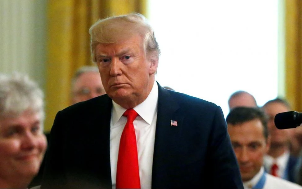 Tổng thống Mỹ Donald Trump tại buổi lễ trao tặng huân chương danh dự cho một sĩ quan không quân tại Nhà Trắng ngày 22-8. Ảnh: REUTERS