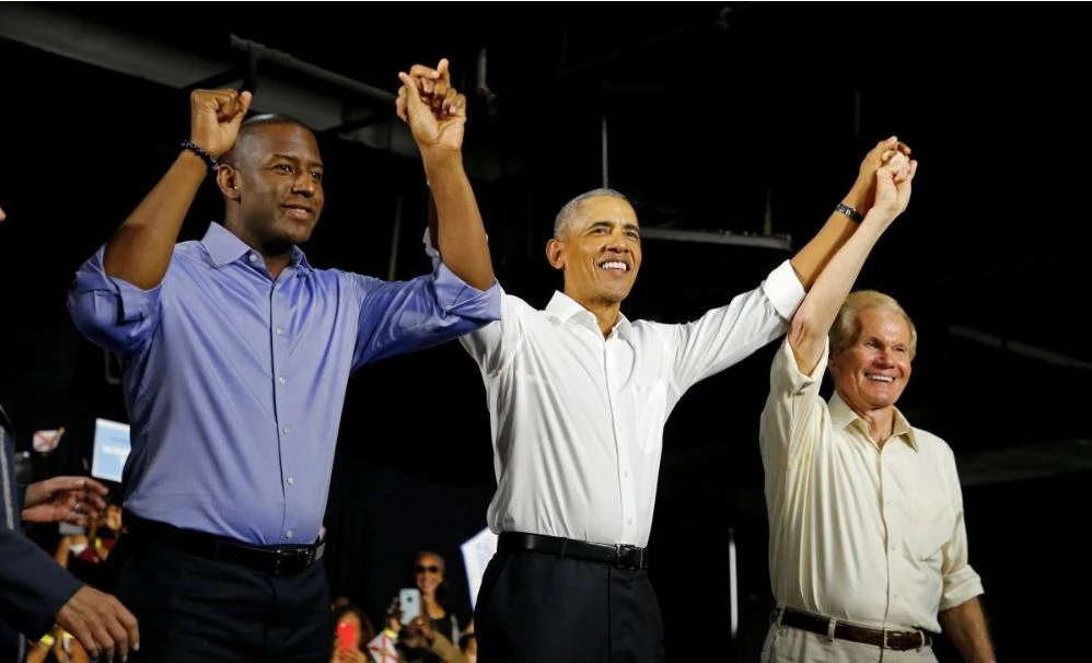 Cựu Tổng thống Mỹ Barack Obama và các ứng viên Dân chủ Andrew Gillum (phải) và Bill Neslon (trái) trong cuộc vận động ở TP Miami, bang Florida (Mỹ) ngày 2-11. Ảnh: REUTERS