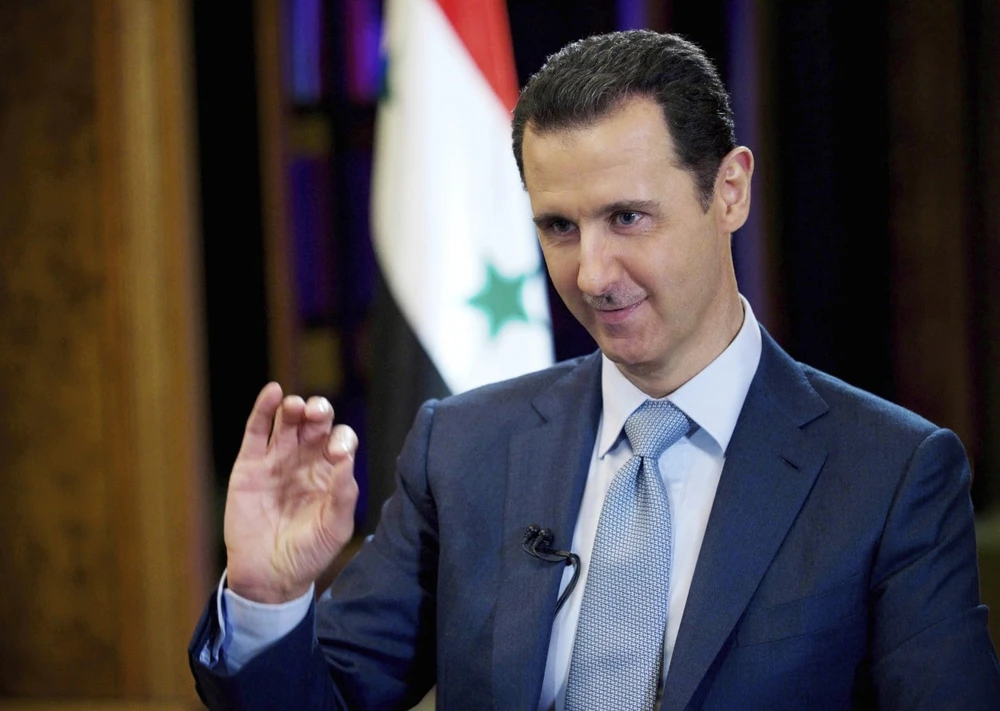 Theo Tổng thống Syria Bashar al-Assad (ảnh), chính phủ Mỹ không e dè vi phạm luật pháp để cướp dầu của Syria vì quyền lợi của các tập đoàn Mỹ, “vì nếu họ không làm các tập đoàn vui lòng, tổng thống có thể bị luận tội”. Ảnh: AP