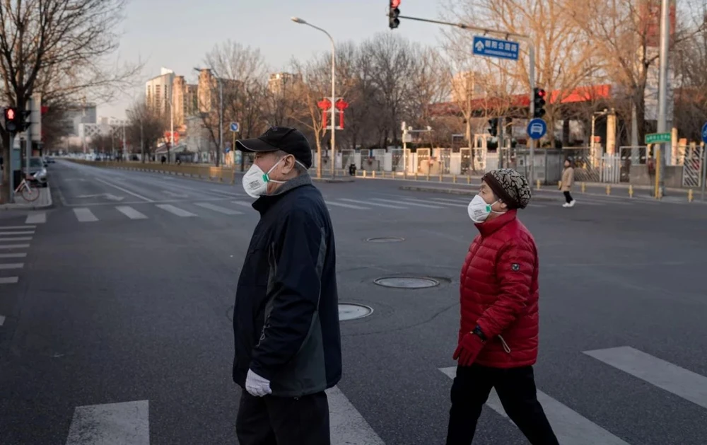 Đường phố Bắc Kinh (Trung Quốc) vắng vẻ trong mùa dịch Corona. Ảnh: AFP