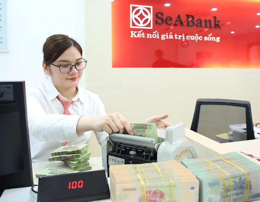 Ngân hàng Nhà nước điều chỉnh tăng lãi suất sẽ giúp thu hút nguồn tiền gửi vào các ngân hàng. Ảnh: PM