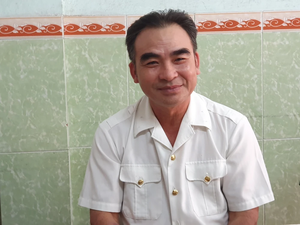 Ông Lê Minh Thoa, một trong chín người trở về sau trận chiến bảo vệ Gạc Ma 35 năm trước. Ảnh: QN