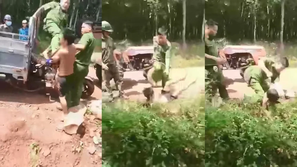 Hình ảnh người mặc sắc phục công an đấm đá túi bụi vào mặt một người dân. Ảnh: Cắt từ clip