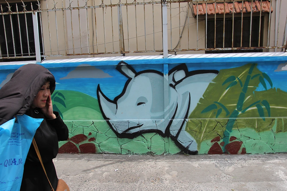 Ngắm những bức tường bẩn ở quận 1 được thay áo mới ảnh 10