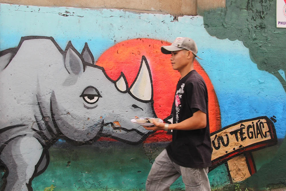 Ngắm những bức tường bẩn ở quận 1 được thay áo mới ảnh 7