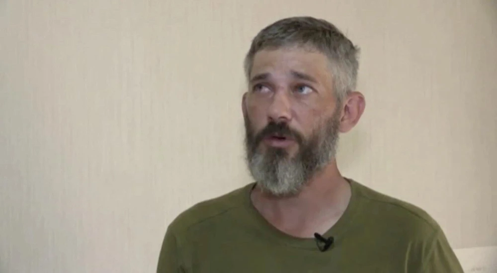 Alexander Drueke bị Nga bắt giữ với cáo buộc là lính đánh thuê ở Ukraine. Ảnh: RU-RTR Alexander Drueke bị Nga bắt giữ với cáo buộc là lính đánh thuê ở Ukraine. Ảnh: RU-RTR