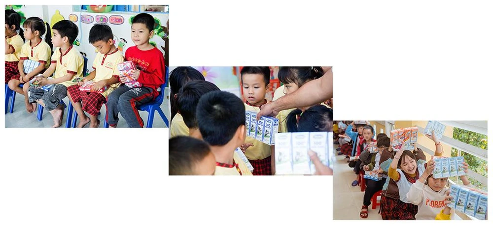 Các em học sinh tại Quảng Nam và Thừa Thiên Huế vui mừng khi nhận sữa Vinamilk.