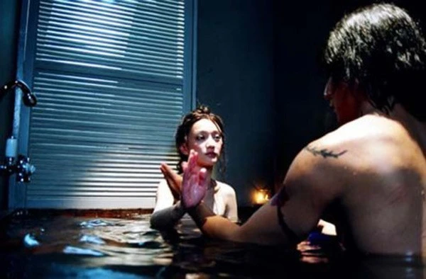 Châu Tấn và Ngô Ngạn Tổ trong phim Dạ yến.