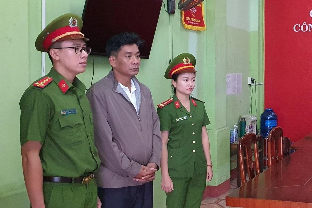 Nguyễn Quốc Anh tại cơ quan công an. Ảnh: T.Hồng