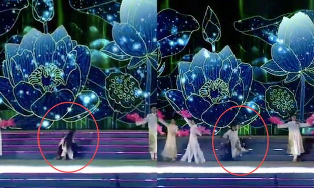 Hình ảnh Hoa hậu Thiên Ân bị ngã khi trình diễn áo dài trong chương trình diễn ra tại TP. Vinh, Nghệ An. Ảnh: Chụp màn hình