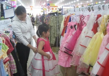Đua với Tết để sắm quần áo cho con ảnh 2 Đua với Tết để sắm quần áo cho con ảnh 2