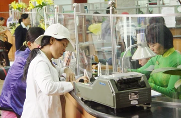 Ngân hàng nhà nước nặng mô hình cơ quan hành chính ảnh 1