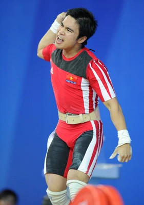 Niềm vui của Hoàng Anh Tuấn sau khi thực hiện thành công mức cử giật 160kg ở lần cuối cùng. Ảnh: Tân Hoa Xã