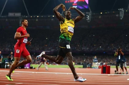 Đội Jamaica của Usain Bolt giành HCV 4x100m ảnh 1