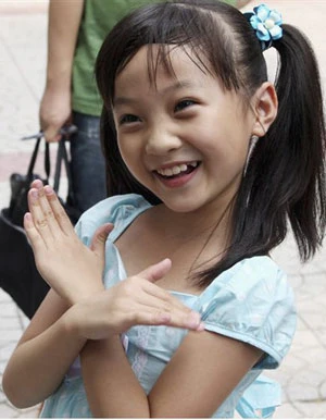 Lin Miaoke với nụ cười dễ thương. Ảnh: Net.