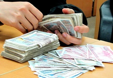 Nộp tiền lẻ vào ngân hàng phải mất phí ảnh 1