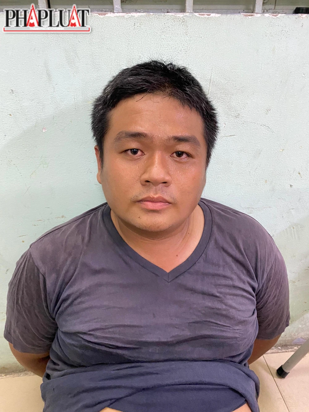 Tuấn tại cơ quan điều tra. Ảnh: CA