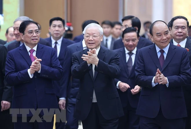 Tổng Bí thư Nguyễn Phú Trọng, Chủ tịch nước Nguyễn Xuân Phúc, Thủ tướng Phạm Minh Chính tới dự Hội nghị Chính phủ với lãnh đạo các tỉnh, thành, sáng 3-1. Ảnh: TTXVN